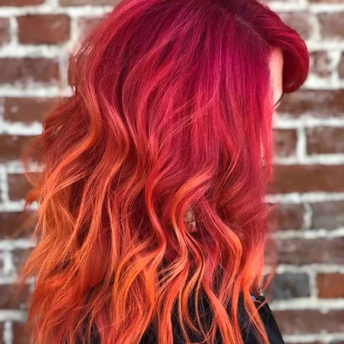 Vivid color melt, magenta roots into fiery orange ends