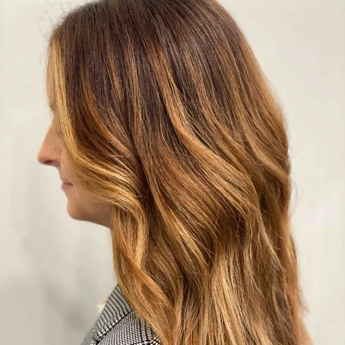Copper-caramel balayage on a brunette base