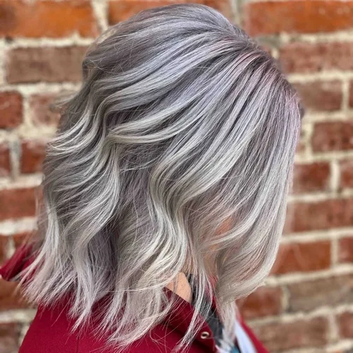 Silver grey blending on a wavy lob