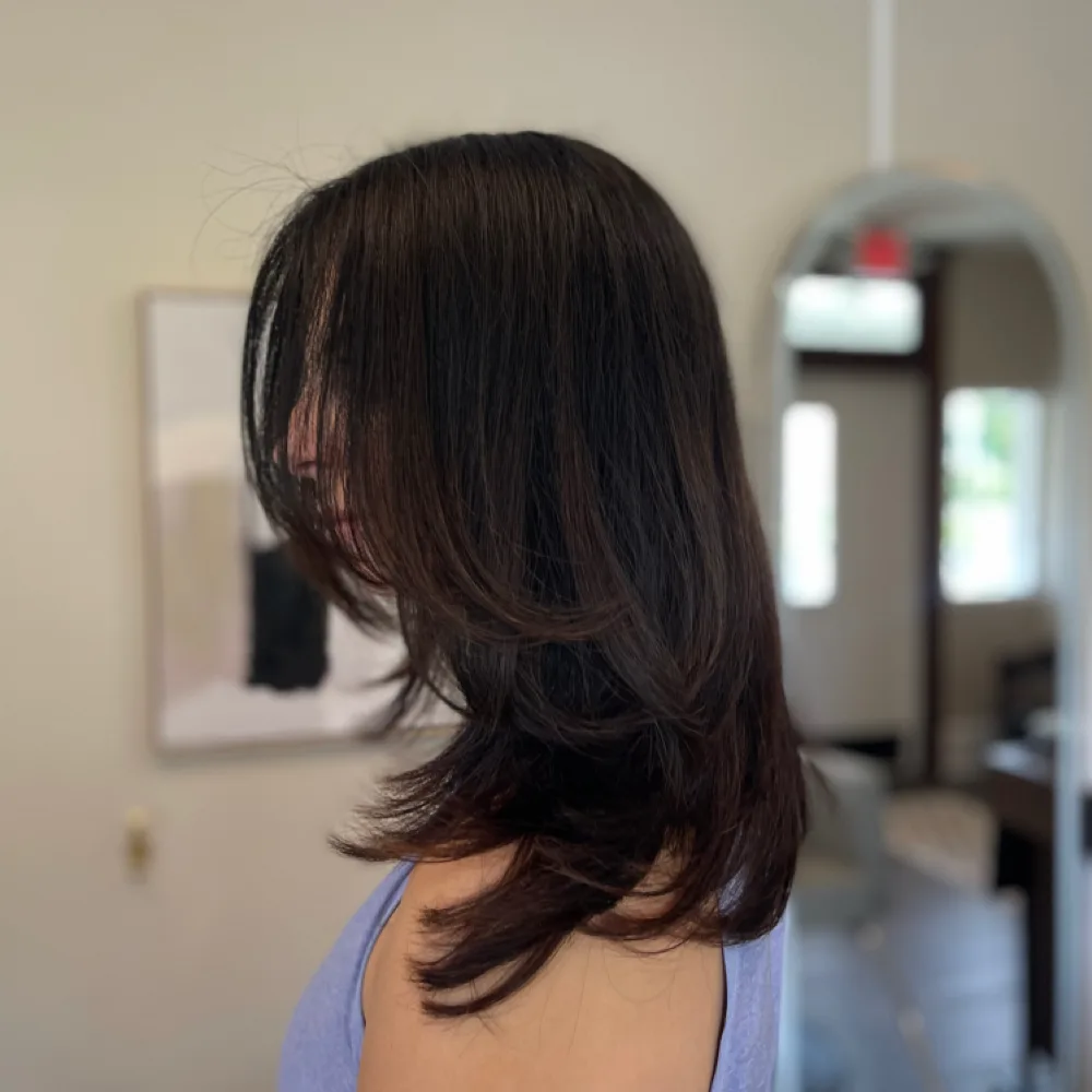 Root color with grey coverage and a long layered cut