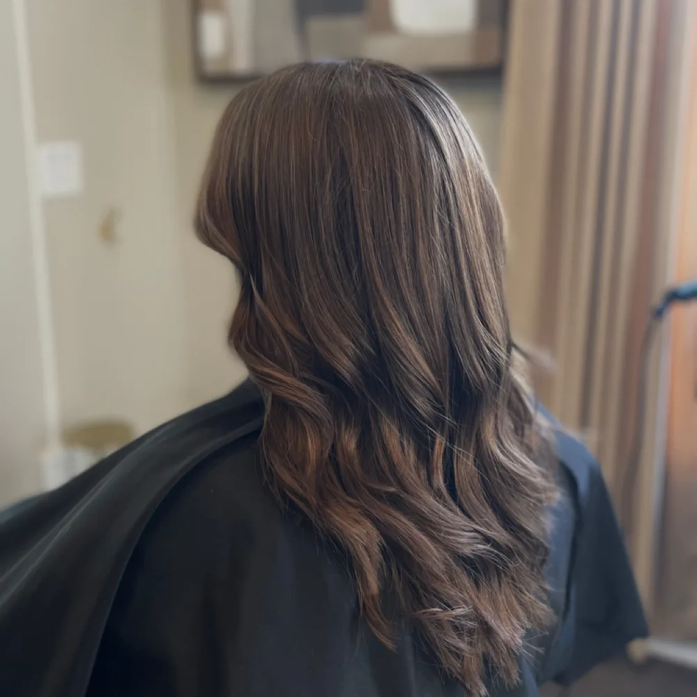 Long layered cut with curtain bangs